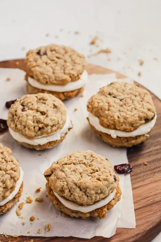 Cranberry-Oatmeal Sandwiches arranged on cutting board 