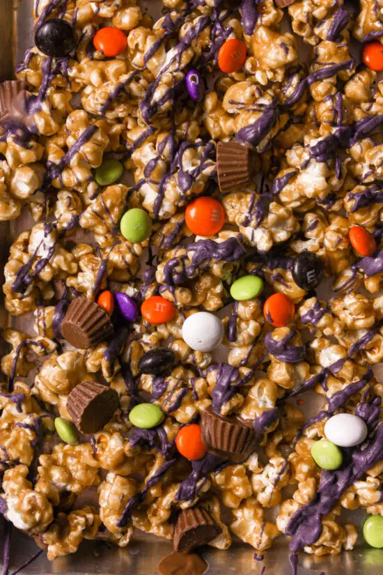 Up close shot of Halloween Caramel Corn and colored coated candies.