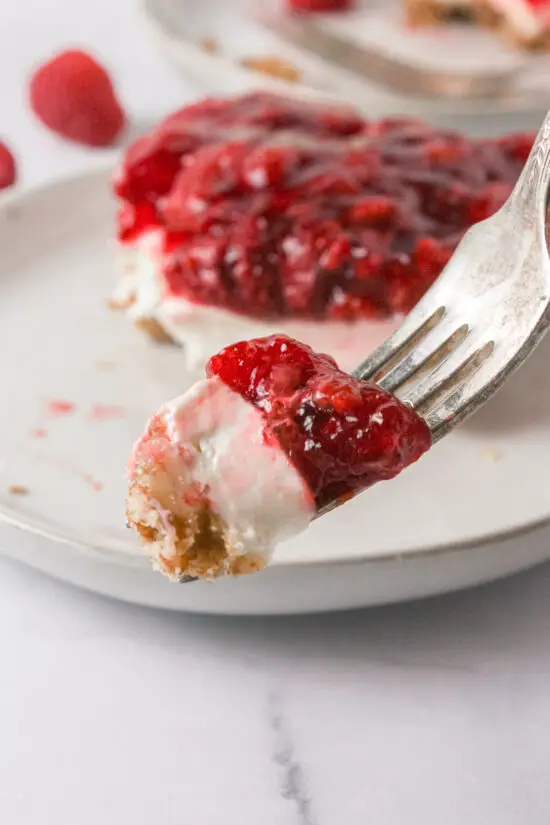 Up close forkful of Raspberry Pretzel Salad.