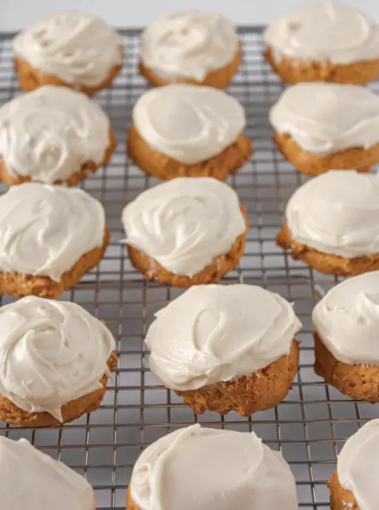 Cookie rack filled with Soft Pumpkin Cookies with Cream Cheese Frosting. 