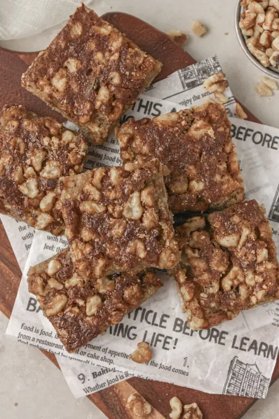 Stack of Maple Walnut Bars on a wooden board. 