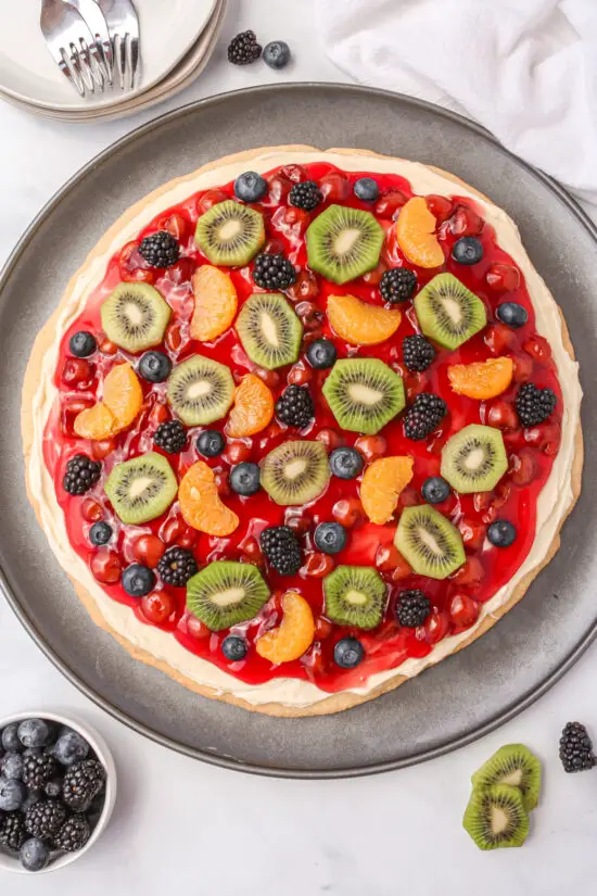 Fruit Pizza on pizza pan with mixed fruit on top.