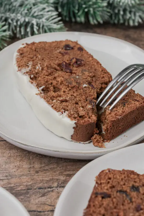 Slice of Favorite Old-Fashioned Gingerbread Loaf Recipe on a plate with fork. 