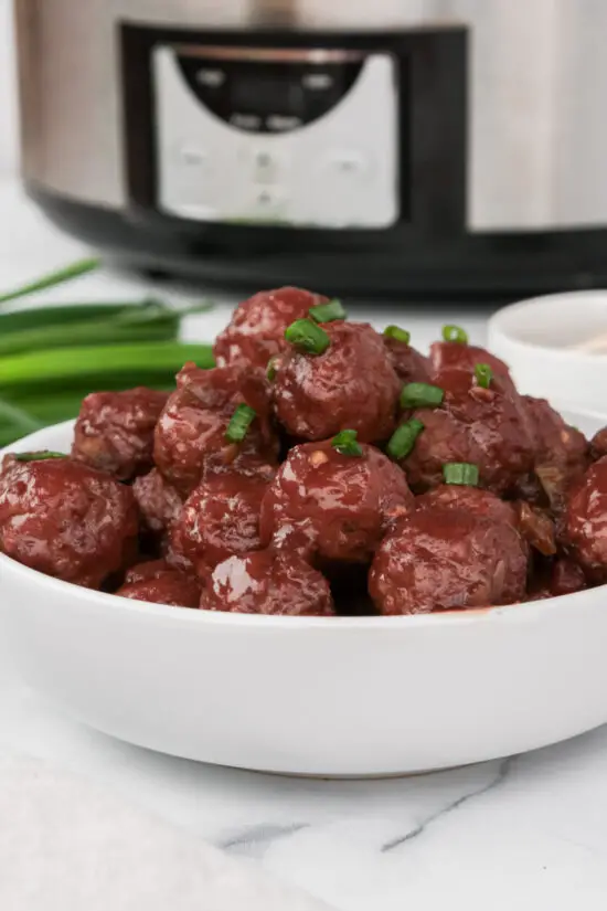 Bowl of Easy Slow Cooker Grape Jelly Meatballs Recipe. 
